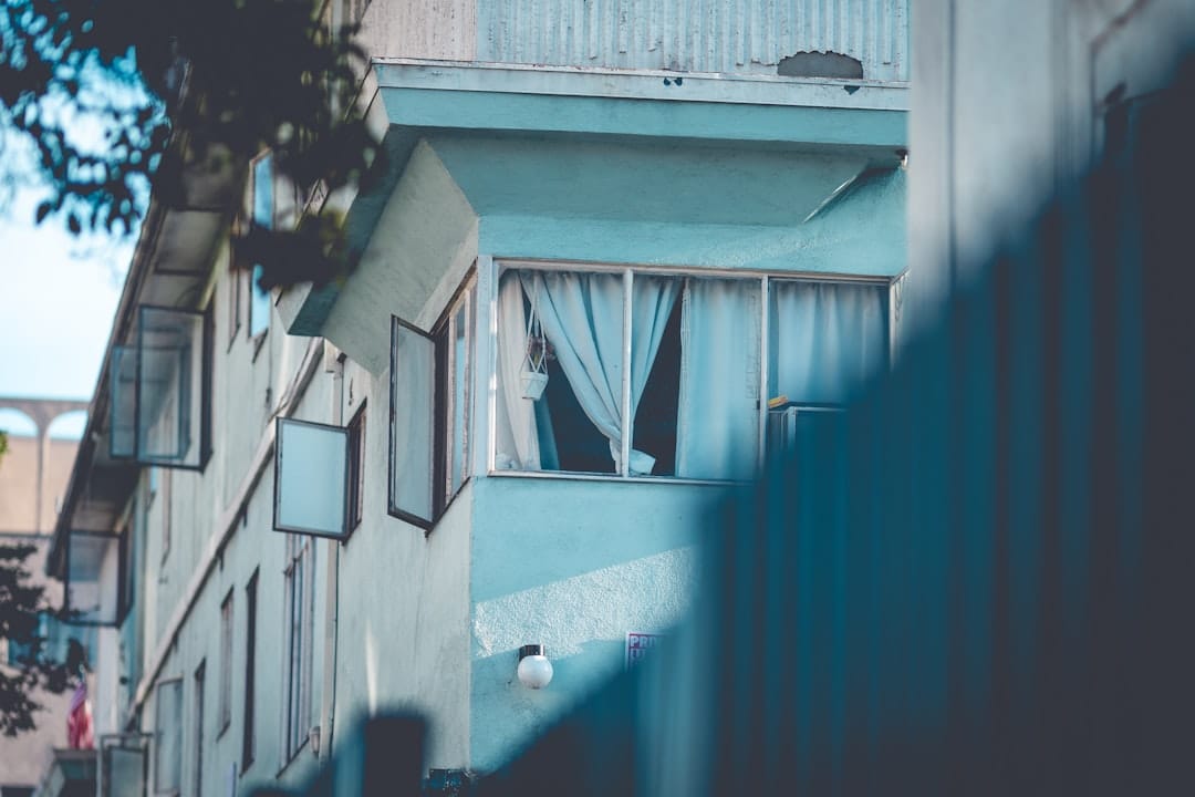 An apartment building with windows and balconies.