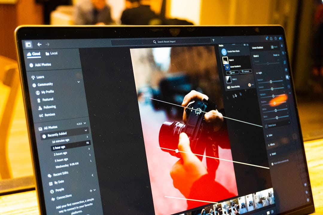Photo editing software is shown on a laptop screen.