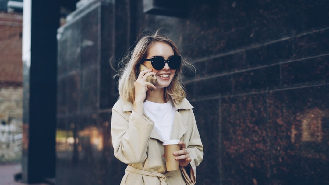 Woman talking on phone with coffee cup