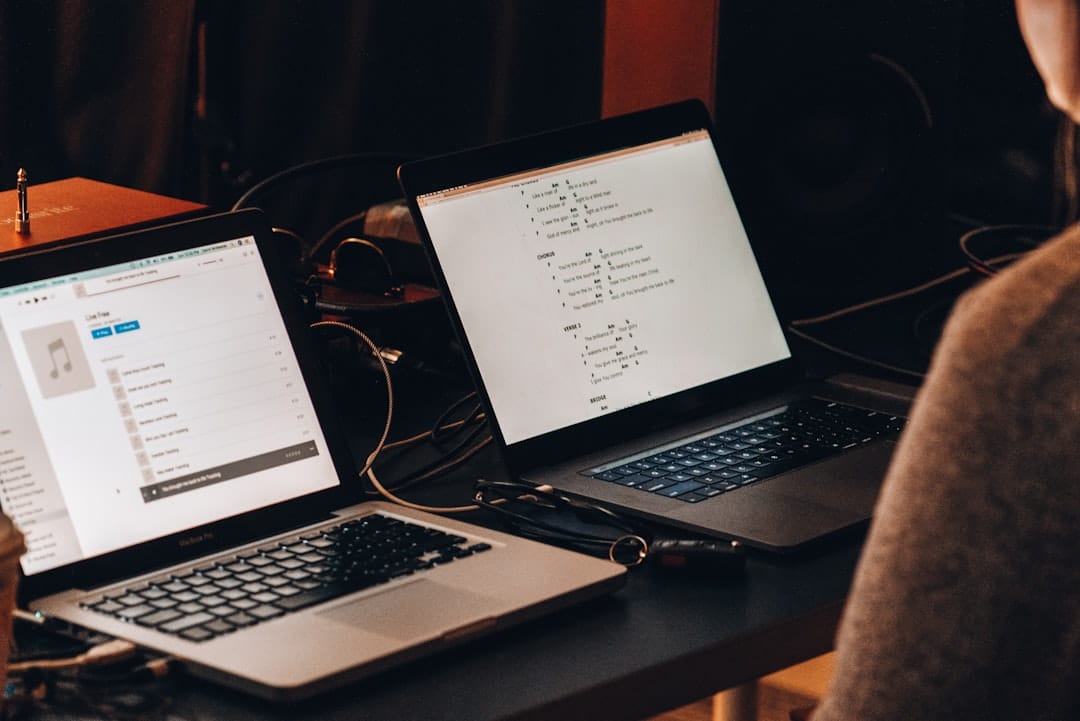 macbook pro on brown wooden table