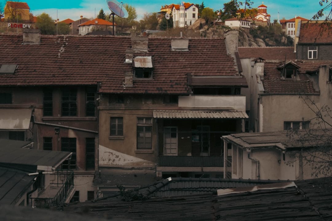 Old european town with tiled roofs and hills.