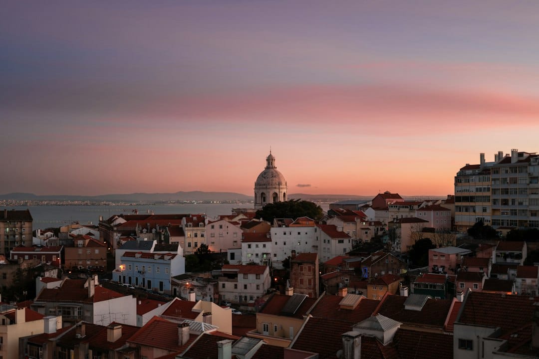 Lisbon's skyline glows under a beautiful sunset