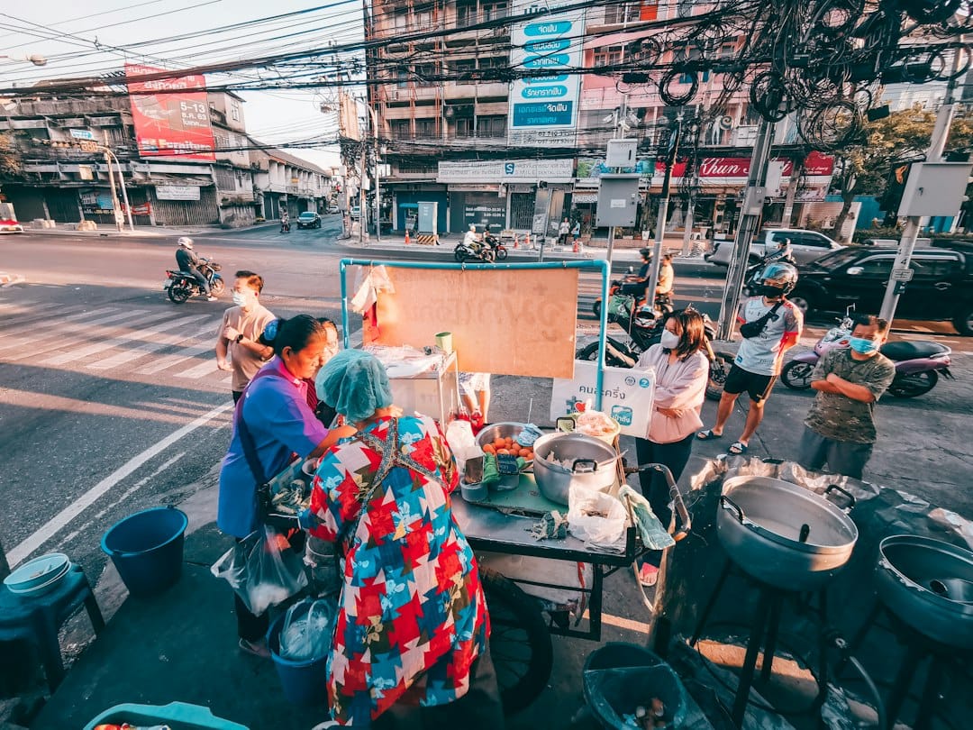 people sitting on the street during daytime