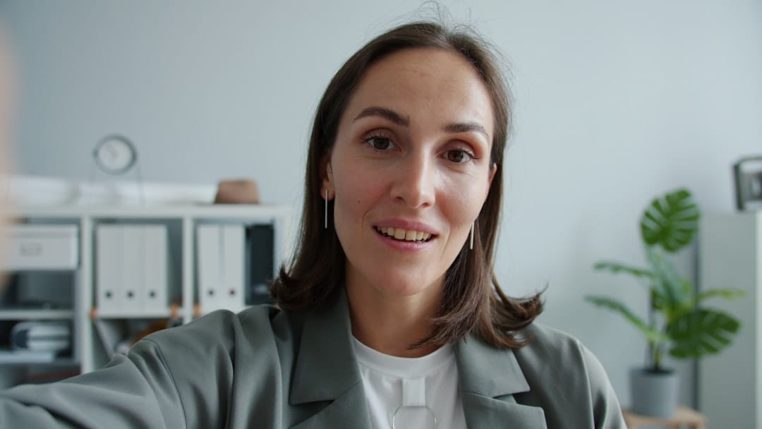 Woman in a suit looking at the camera