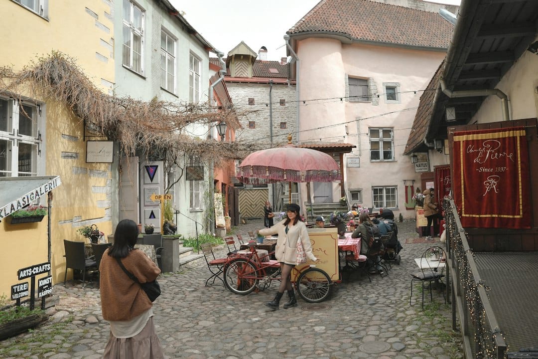 Cobblestone street with outdoor cafe and people