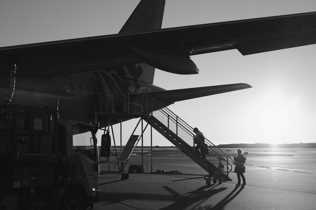 A large jetliner sitting on top of an airport tarmac