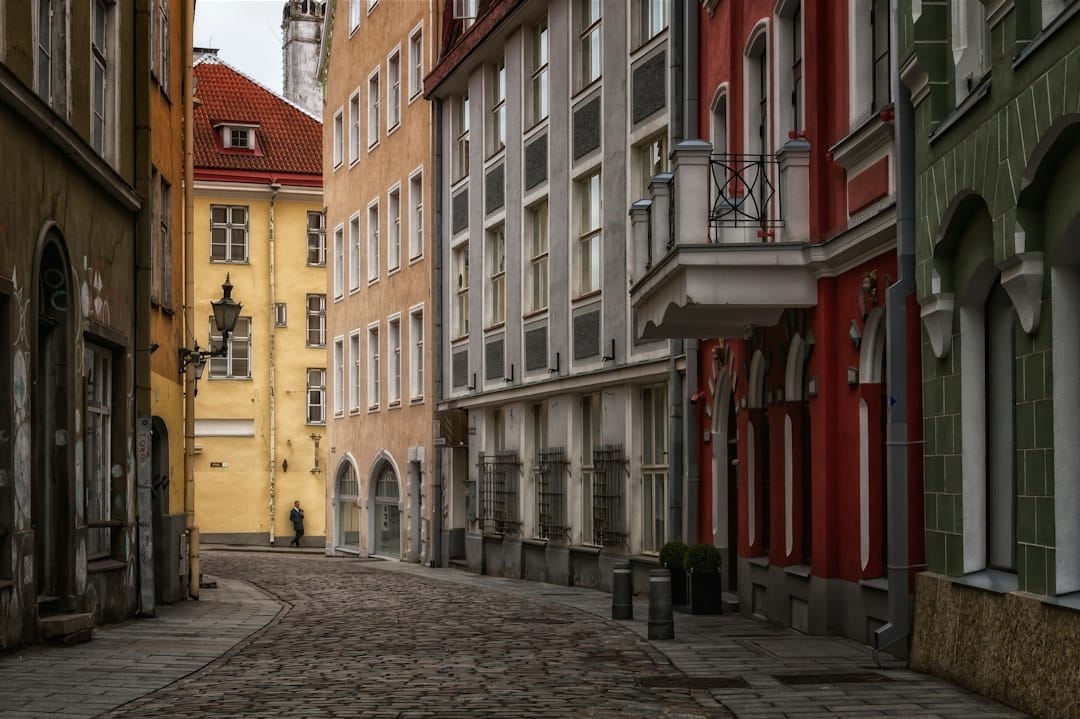 Narrow cobblestone street with colorful historic buildings