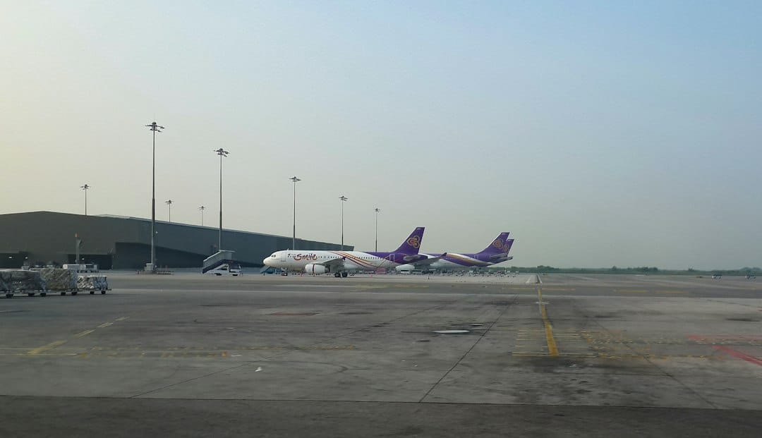a couple of planes that are on a runway