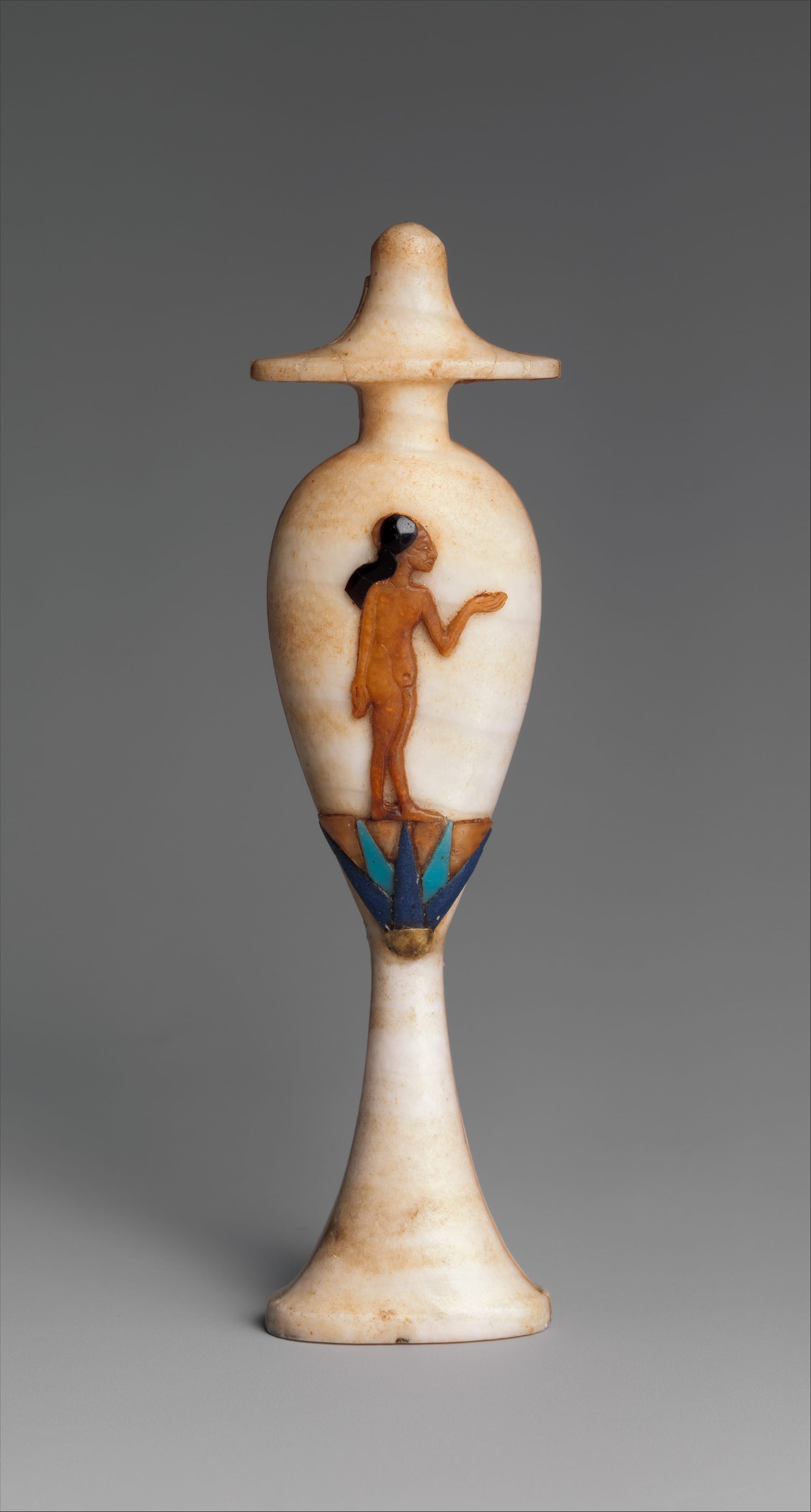 Ancient Egyptian alabaster perfume vessels and cosmetic jars used in ritual preparation.