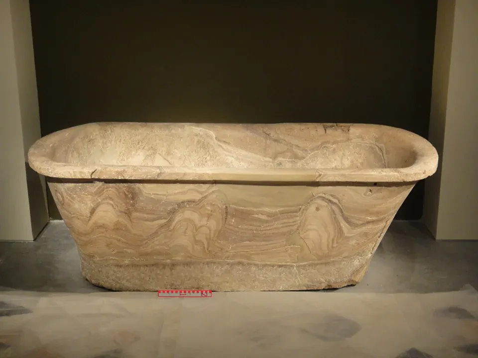 Ancient Egyptian stone bathtub used for ritual bathing and purification.