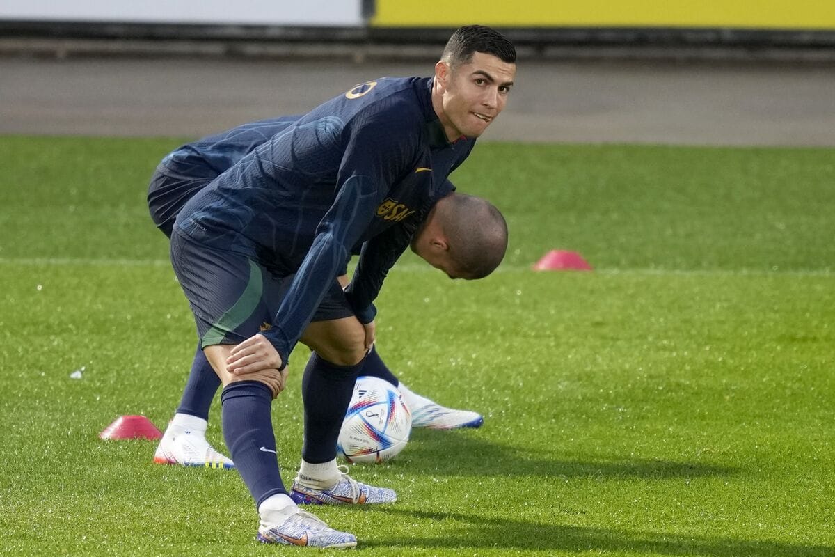 Cristiano Ronaldo training alone on the pitch before a match, focused and composed, embodying elite identity through routine and preparation