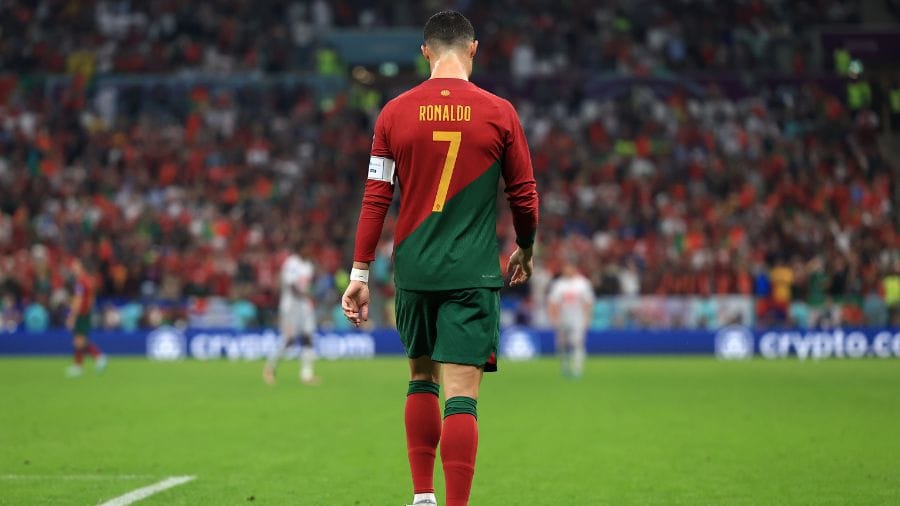 Cristiano Ronaldo walking back toward the center circle after a play, calm and composed, embodying consistency and inevitability