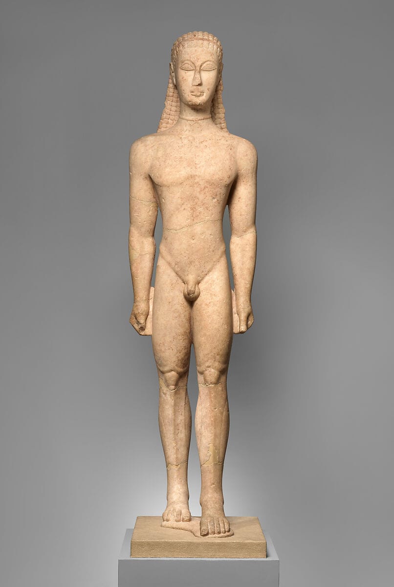 Ancient Greek marble kouros statue standing in a rigid frontal posture