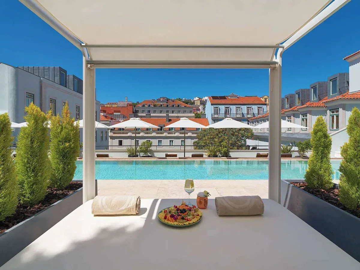 Luxury rooftop pool at The One Palácio da Anunciada in Lisbon — a soft-abundance manifestation hotel perfect for raising your vibration.