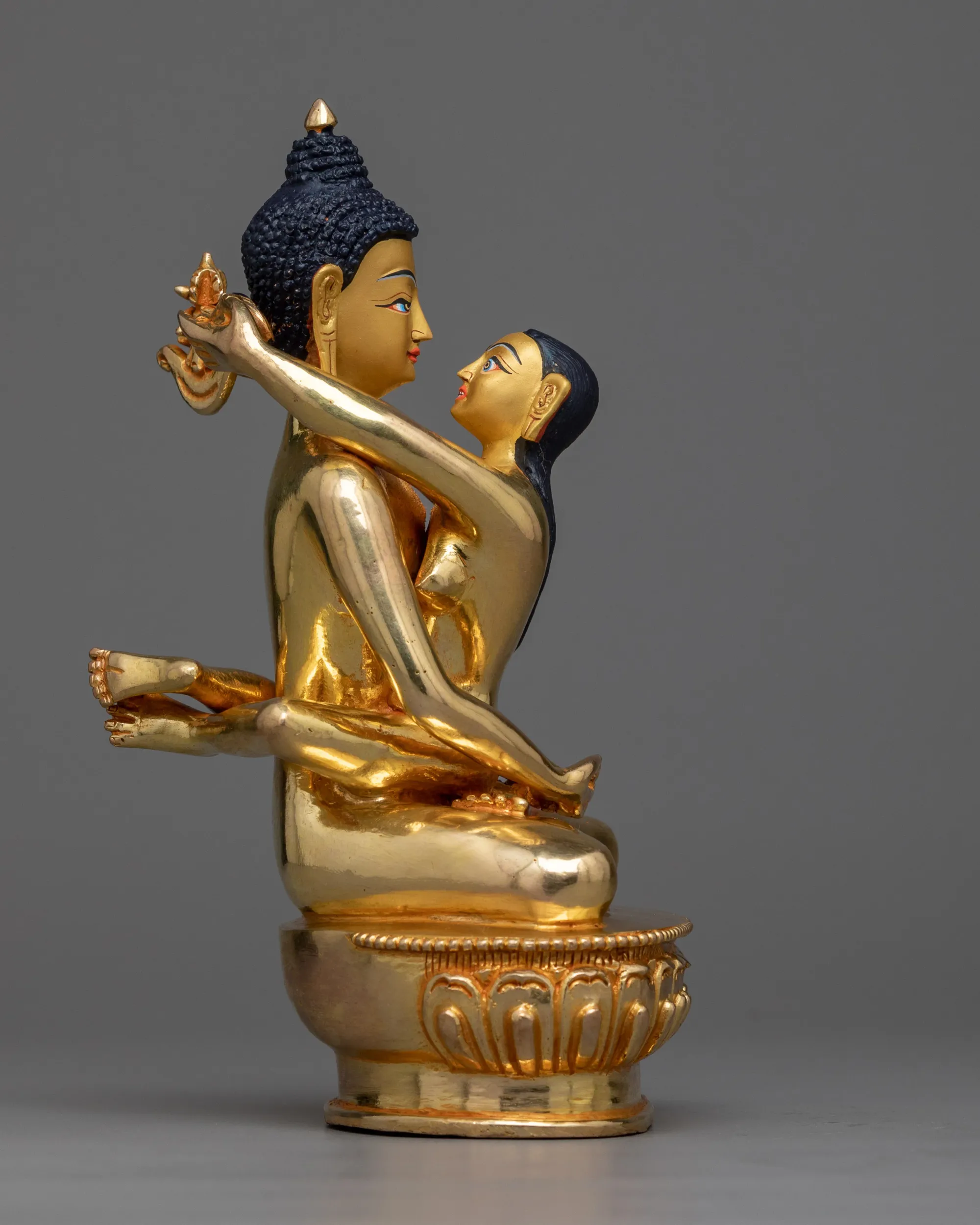 Yab Yum tantric union Buddha and consort symbolizing divine feminine wisdom and divine masculine compassion.