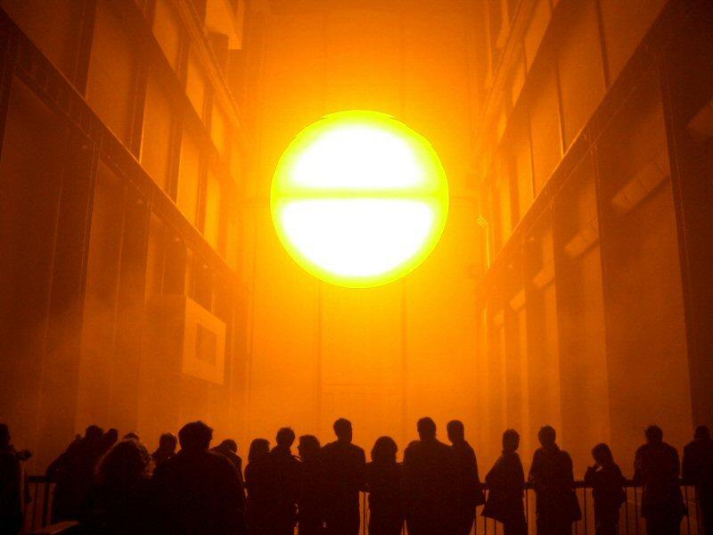 Olafur Eliasson’s “The Weather Project,” a large-scale light installation with a glowing circular sun form illuminating Tate Modern’s Turbine Hall.