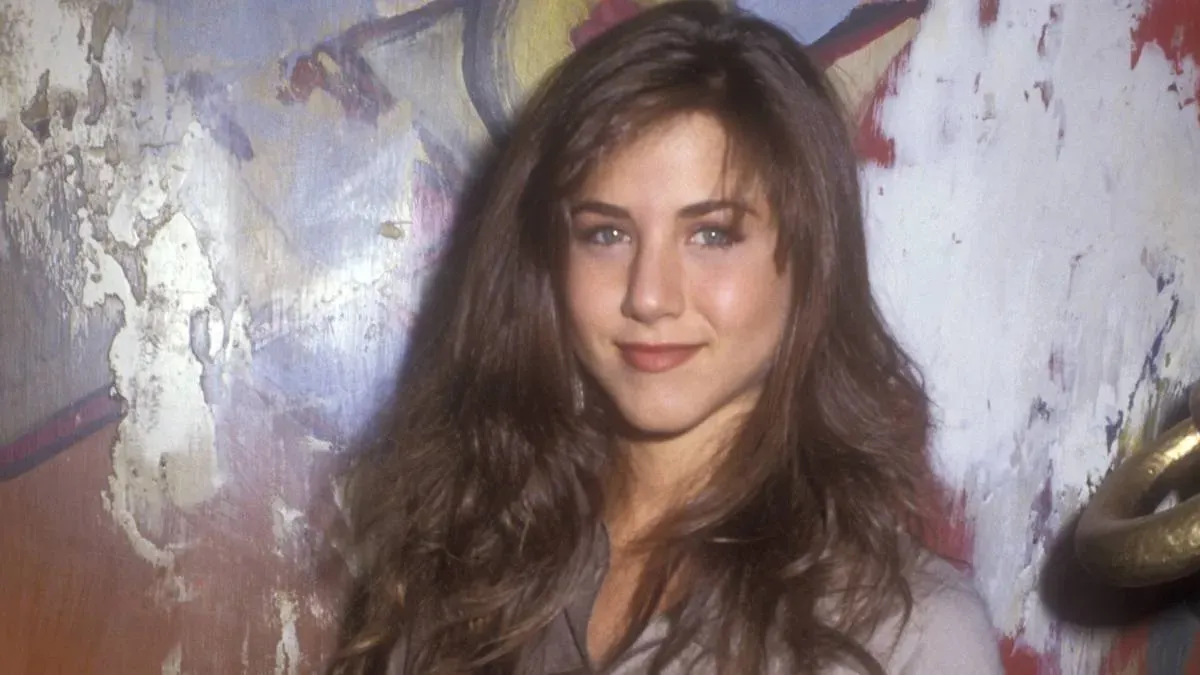 Young Jennifer Aniston portrait from her early years, symbolizing intention-setting, resilience, and manifestation before fame.