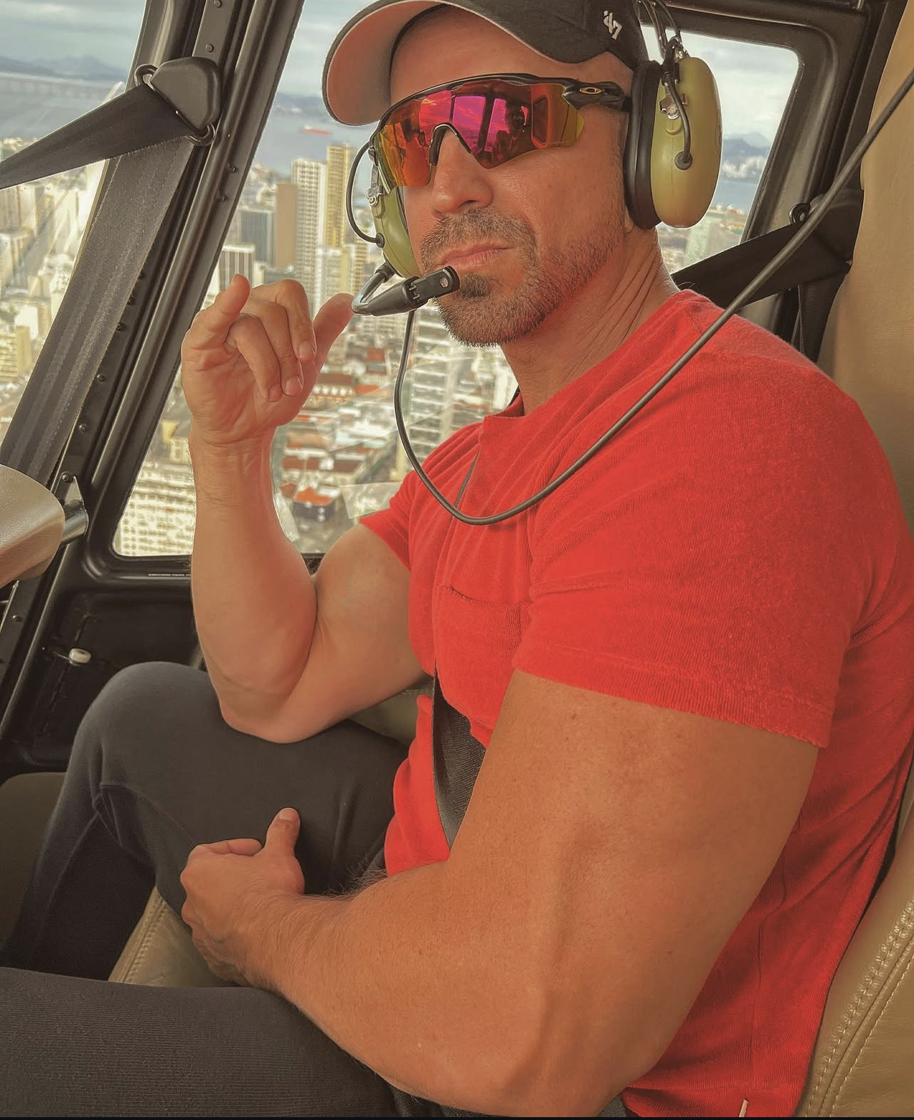 Hector Jesus Arencibia in a private helicopter over Rio de Janeiro representing success lifestyle and manifestation results