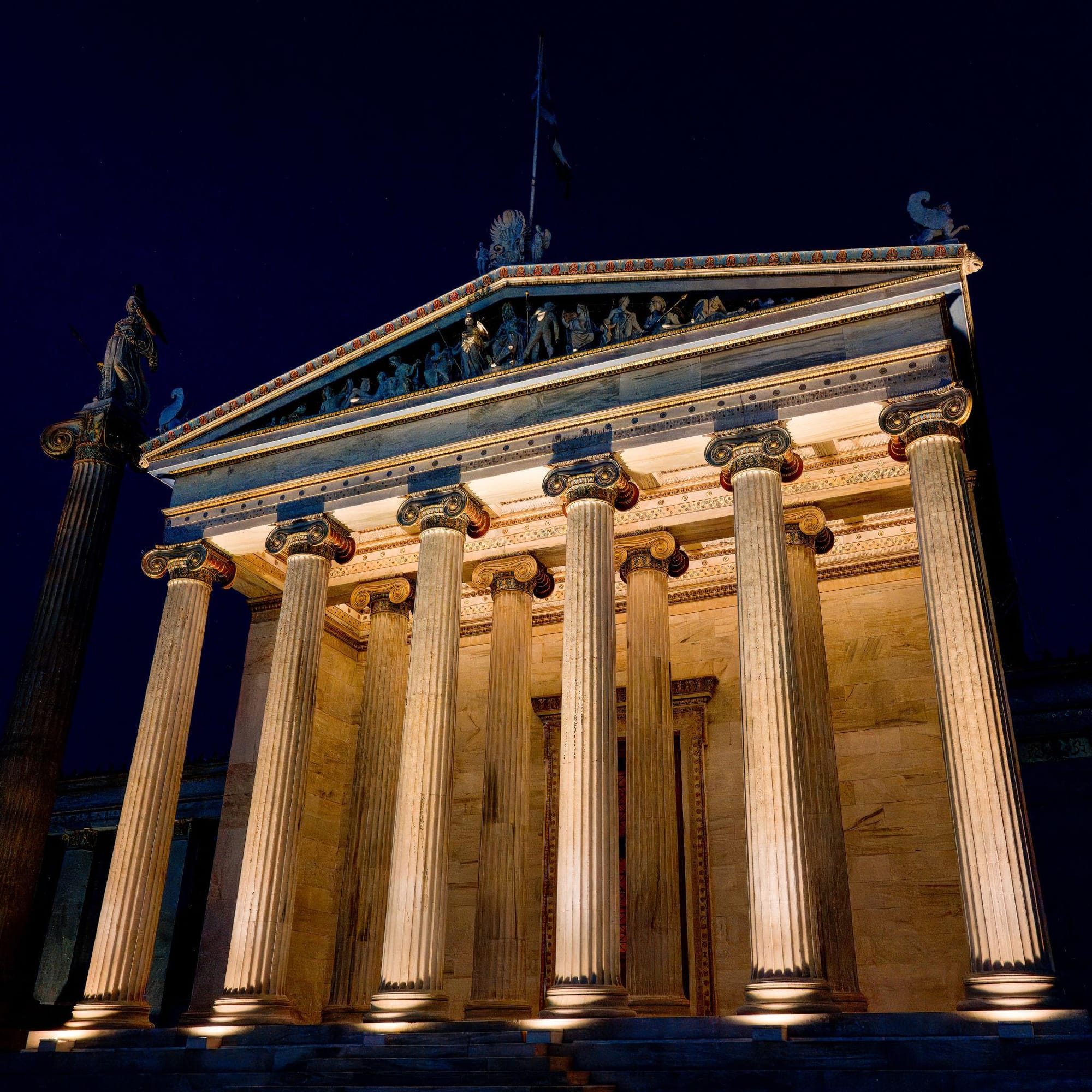 Academy of Athens neoclassical building columns Greece night Theophil Hansen architecture