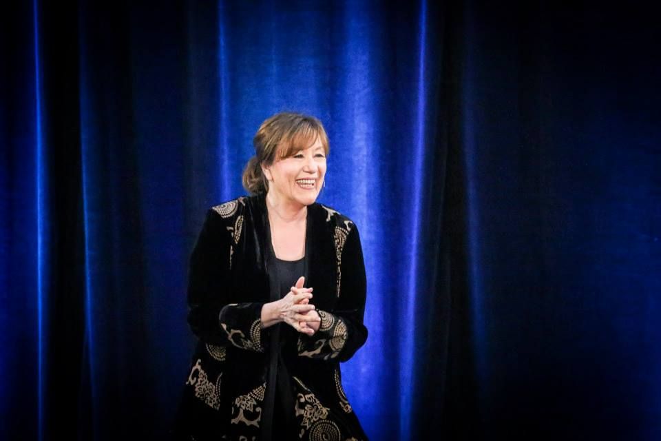 Esther Hicks speaking on stage explaining the Abraham Hicks 17-second rule and manifestation focus technique