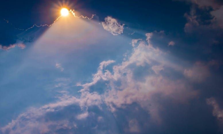 Golden sunlight breaking through clouds symbolizing Neville Goddard imaginal act consciousness imagination creates reality law of assumption