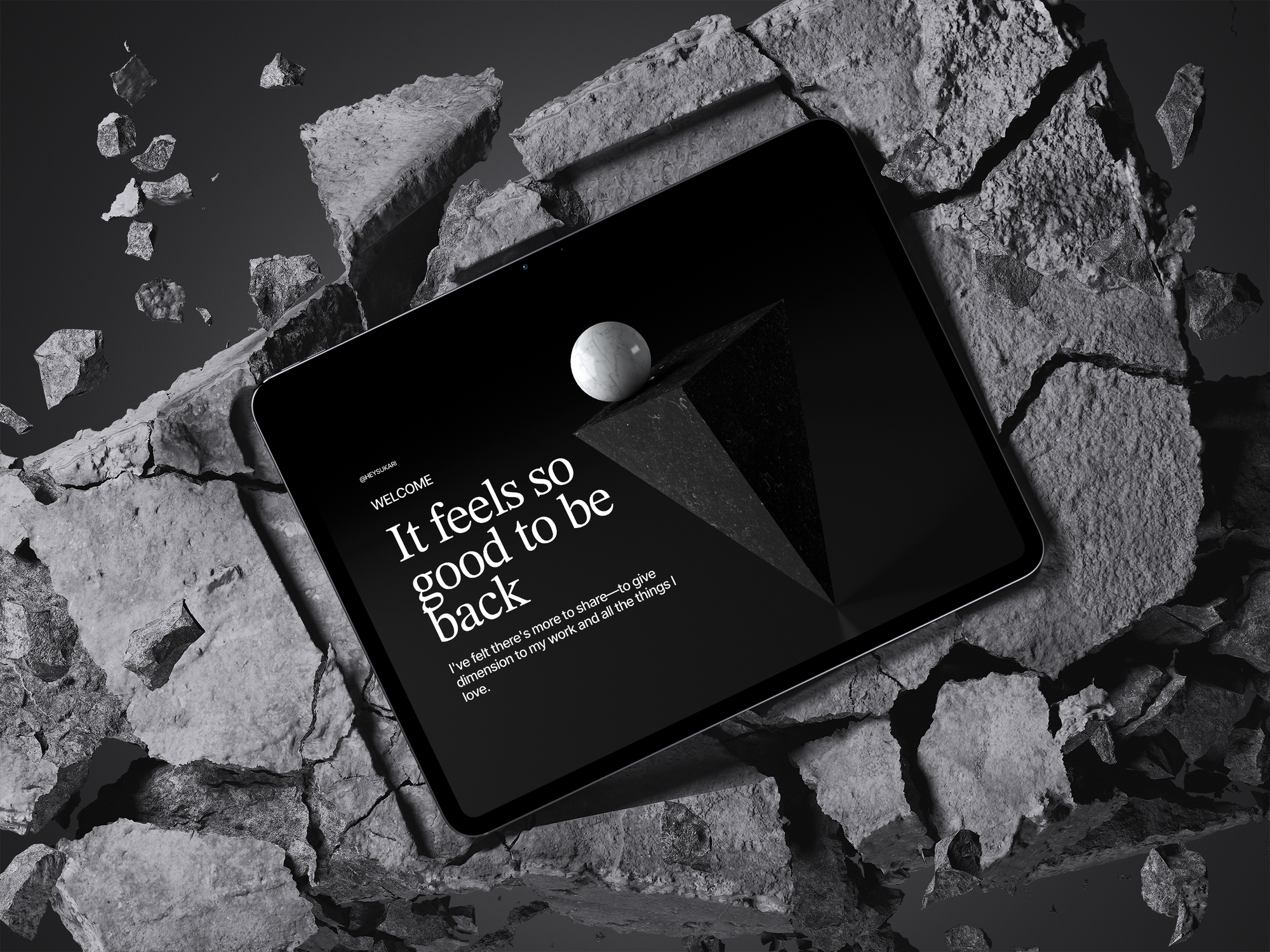 A tablet resting on broken concrete displays a dark editorial screen. Serif headline reads: "It feels so good to be back." Welcome issue by @heysukari.