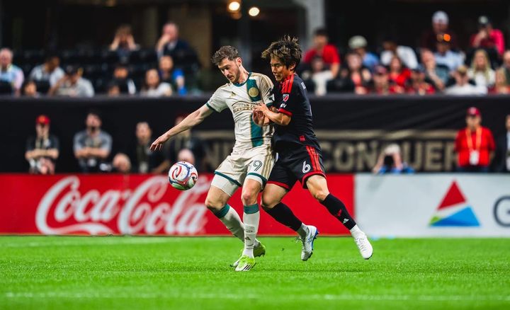 Keisuke Kurokawa and Alexey Miranchuk battle for the ball during D.C. United's MLS game at Atlanta United.