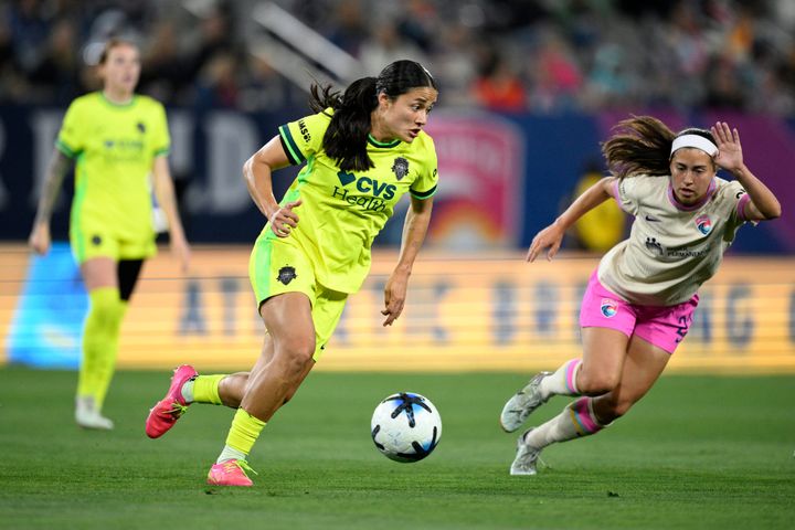 Rebeca Bernal dribbles as Lia Godfrey approaches during the Washington Spirit's game at the San Diego Wave.