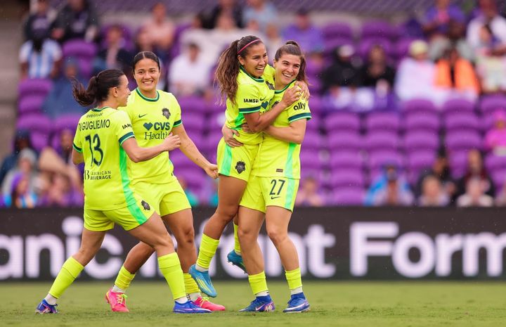 Lucia Di Guglielmo, Rebeca Bernal, Leicy Santos, and Sofia Cantore celebrate during the Washington Spirit's win over the Orlando Pride.