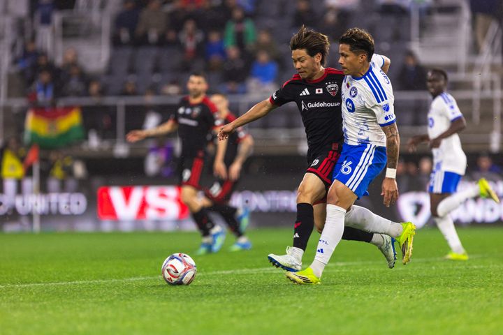 Keisuke Kurokawa and Wiki Carmona battle for the ball during D.C. United's draw with CF Montréal.