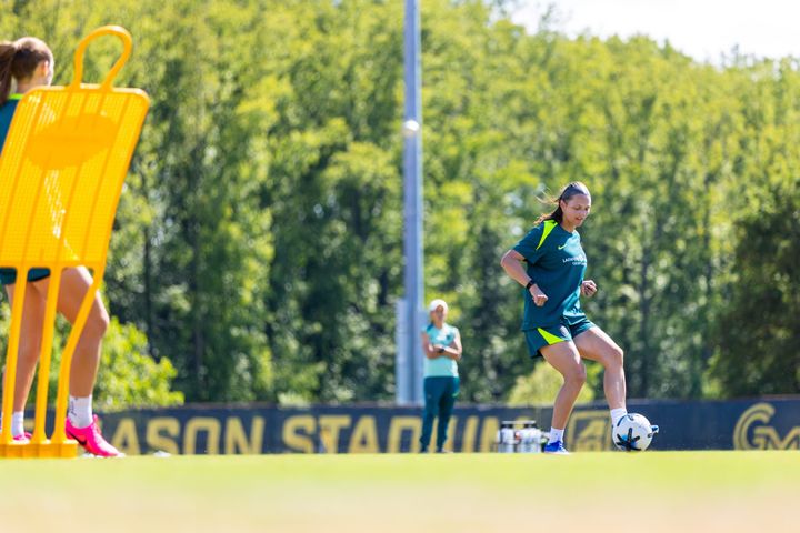 Ashley Hatch strikes a pass during the Washington Spirit's training session at George Mason University.