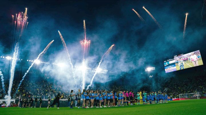 Fireworks go off as the Washington Spirit and Kansas City Current stand at midfield at Audi Field.
