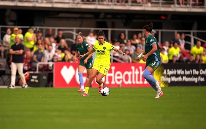 Sofia Cantore dribbles against Kaleigh Kurtz as the Washington Spirit played the Denver Summit.