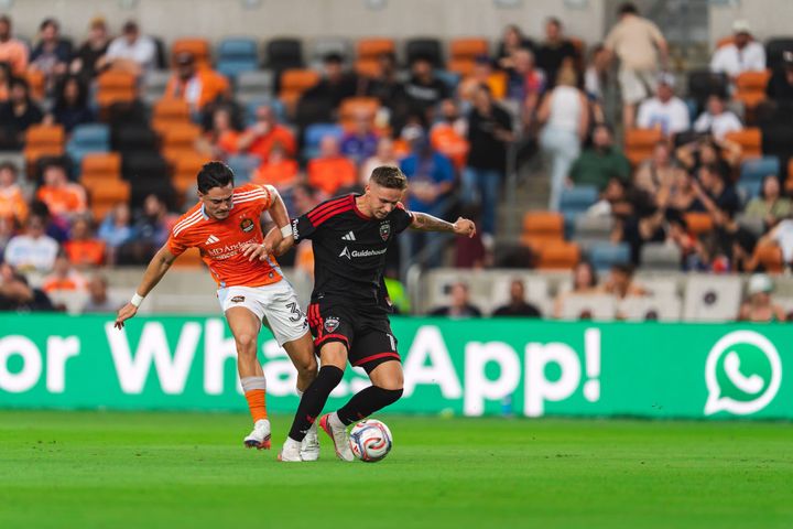 Louis Munteanu and Felipe Andrade battle for the ball during D.C. United's game against the Houston Dynamo.
