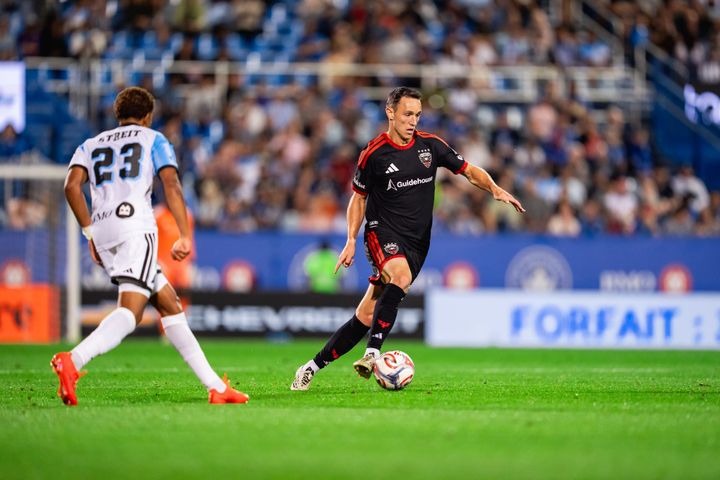 Silvan Hefti dribbles away from Noah Streit during D.C. United's game at CF Montréal.