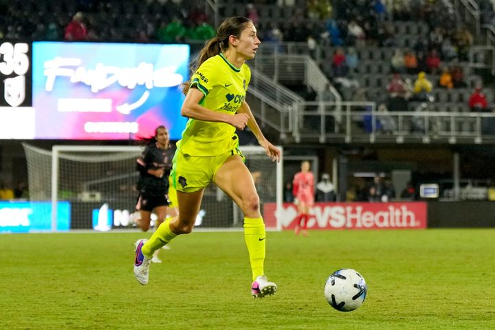 Paige Metayer looks upfield while dribbling the ball as the Washington Spirit plays Angel City FC.