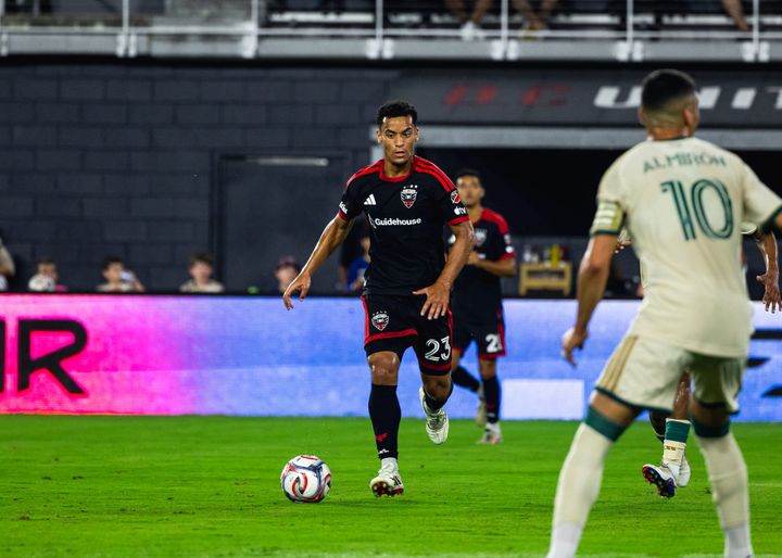 Brandon Servania dribbles during a game between D.C. United and Atlanta United.