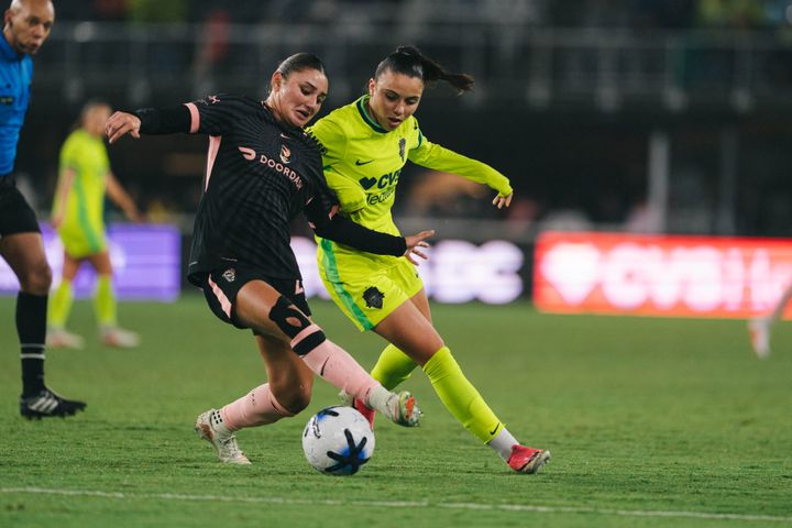 Mélissa Bethi and Gisele Thompson battle for the ball during a game between the Washington Spirit and Angel City FC.