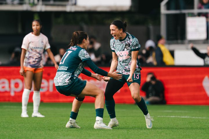 Lucia Di Guglielmo and Sofia Cantore celebrate a goal during the Washington Spirit's game against Gotham FC.