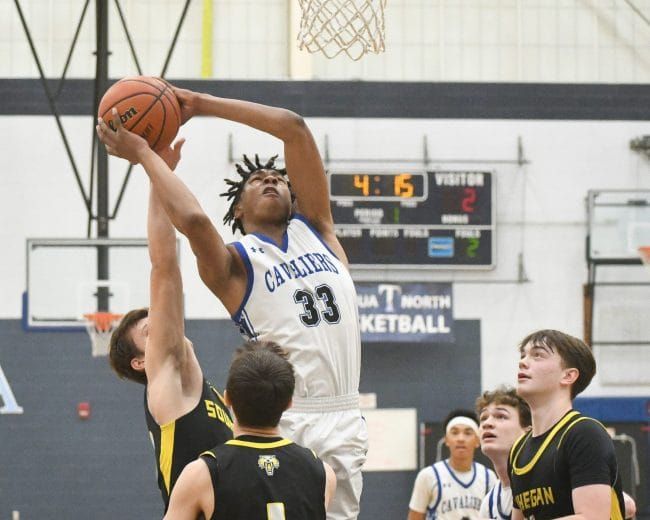 Late surge helps Hollis Brookline boys basketball pull away for D2 playoff win over Souhegan (video)