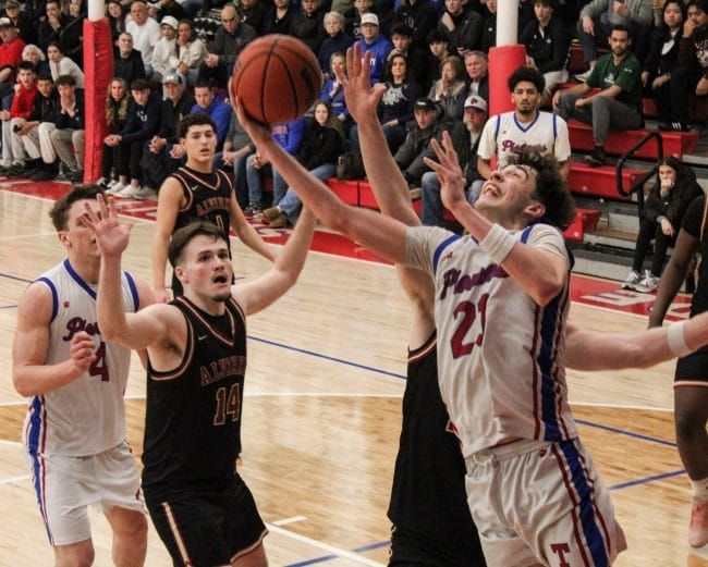 Trinity boys basketball beats Alvirne in OT to avoid D1 playoff upset