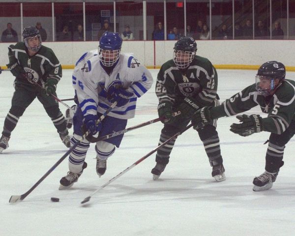Schlapak giving Dover boys hockey offense from the blue line