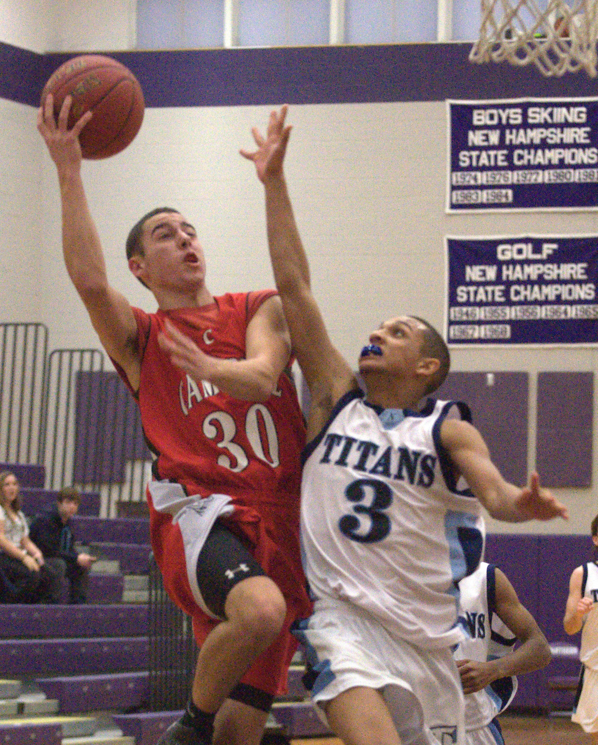 Campbell's Jackson Musco drives to the basket against Nashua North's Miles Cassin-Reed during Saturday's game.