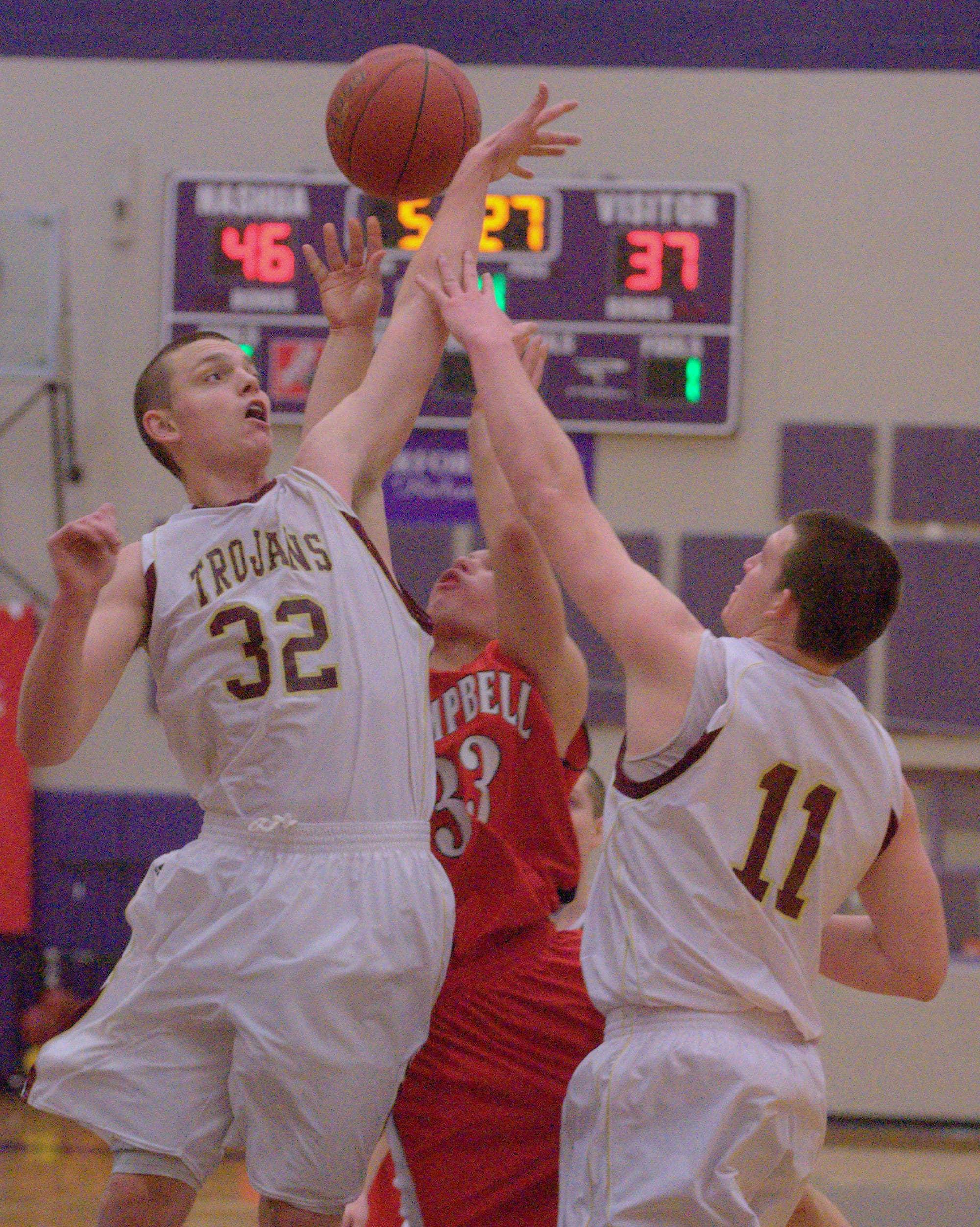 Thornton's Quinn Richardson-Newton, left, and Jeff Gelinas block a shot by Campbell's Trevor Duquette on Friday.