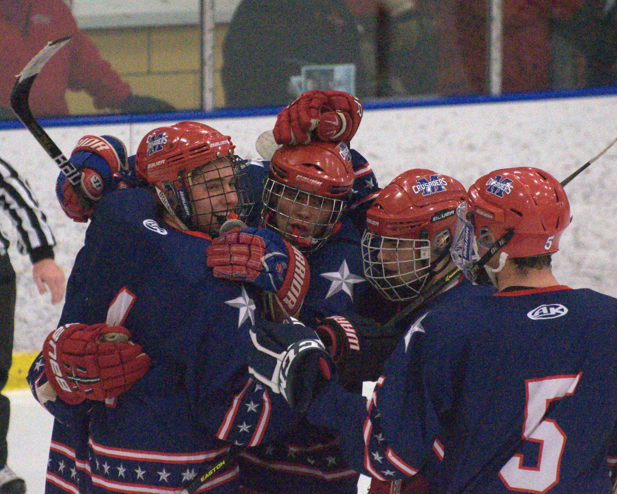 Manchester Memorial players celebrate after Brendan Sullivan, center, scored in the second period of Wednesday game. For more photos, go to the Photo Album.