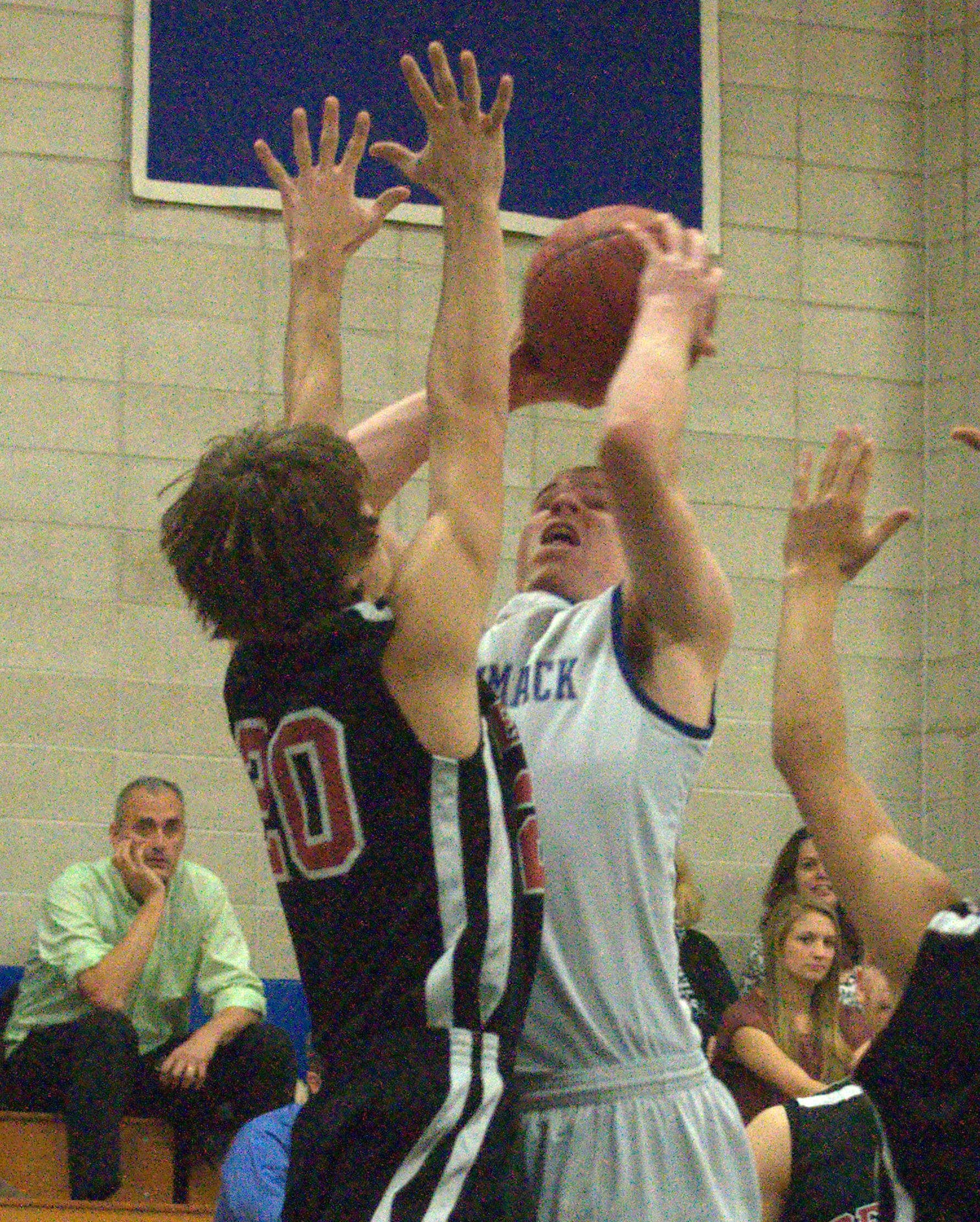 Merrimack's Brad Jarry goes up for a layup against Bedford's Cameron Meservey.