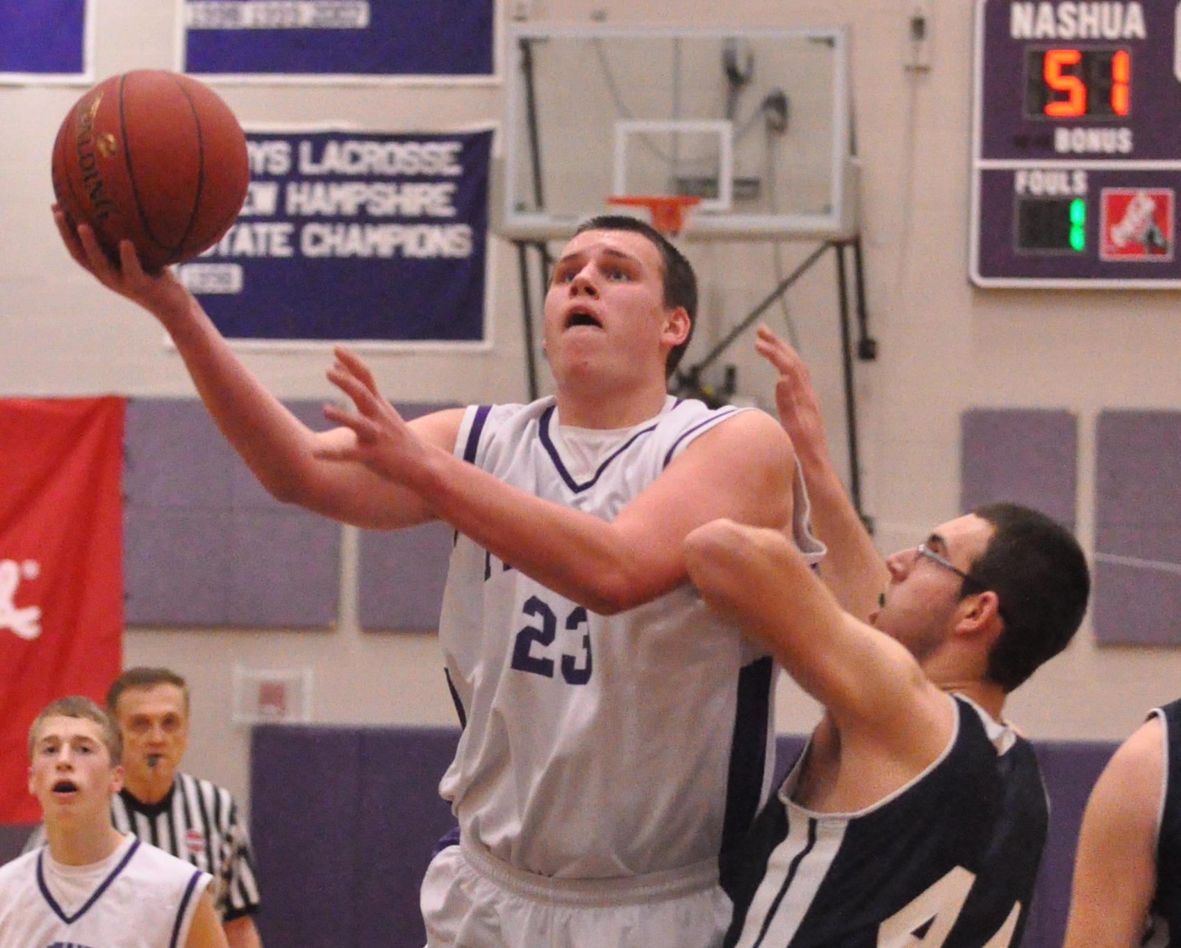 Nashua South's David Dunham drives to the basket during Friday's game against Milford.