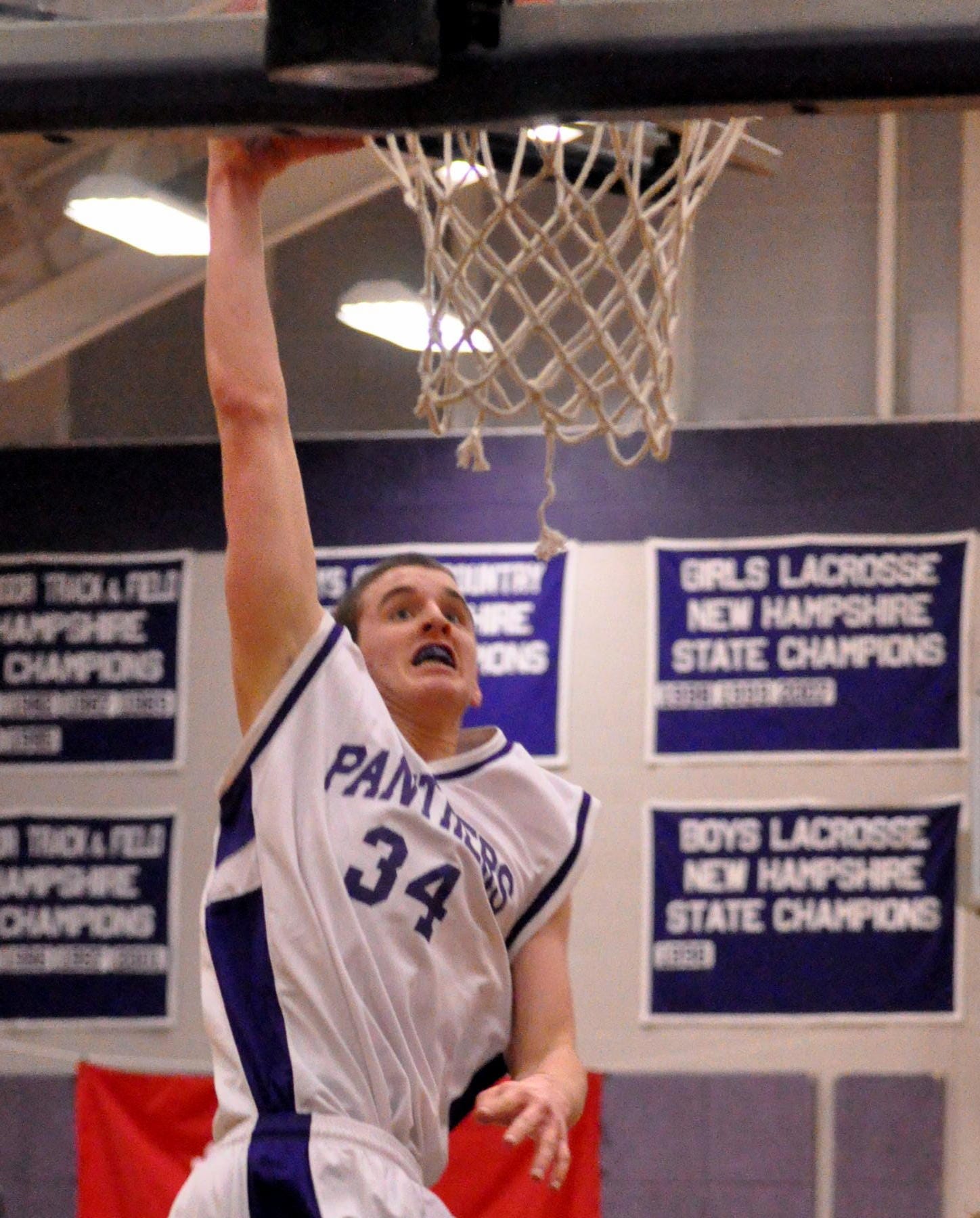 Nashua South's Jack Preston goes in for a dunk.