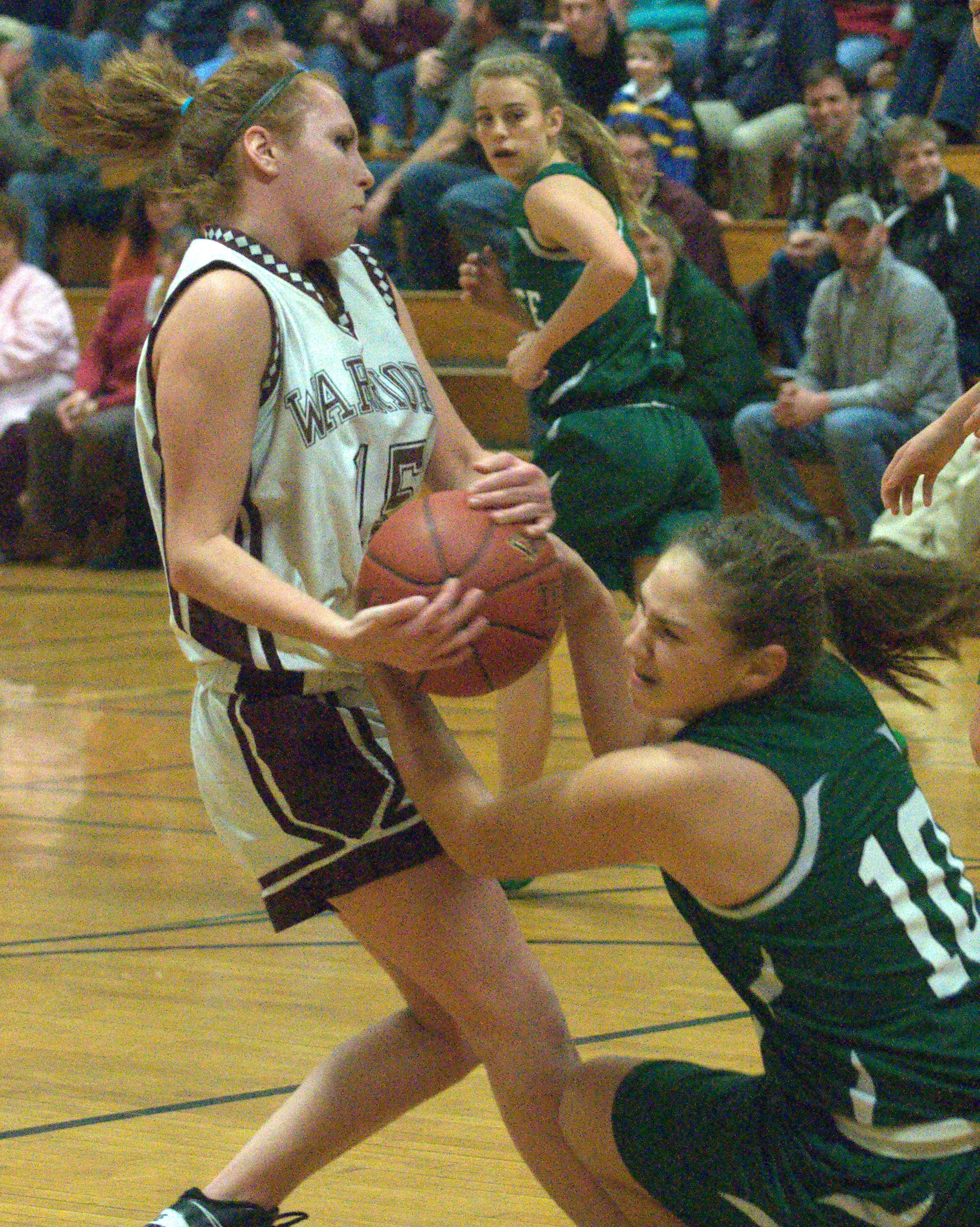 Wilton-Lyndeborough's Deanna Davidson and Sunapee's Faith Larpenter battle for a loose ball during Tuesday's game. For more photos, go to the Photo Album.