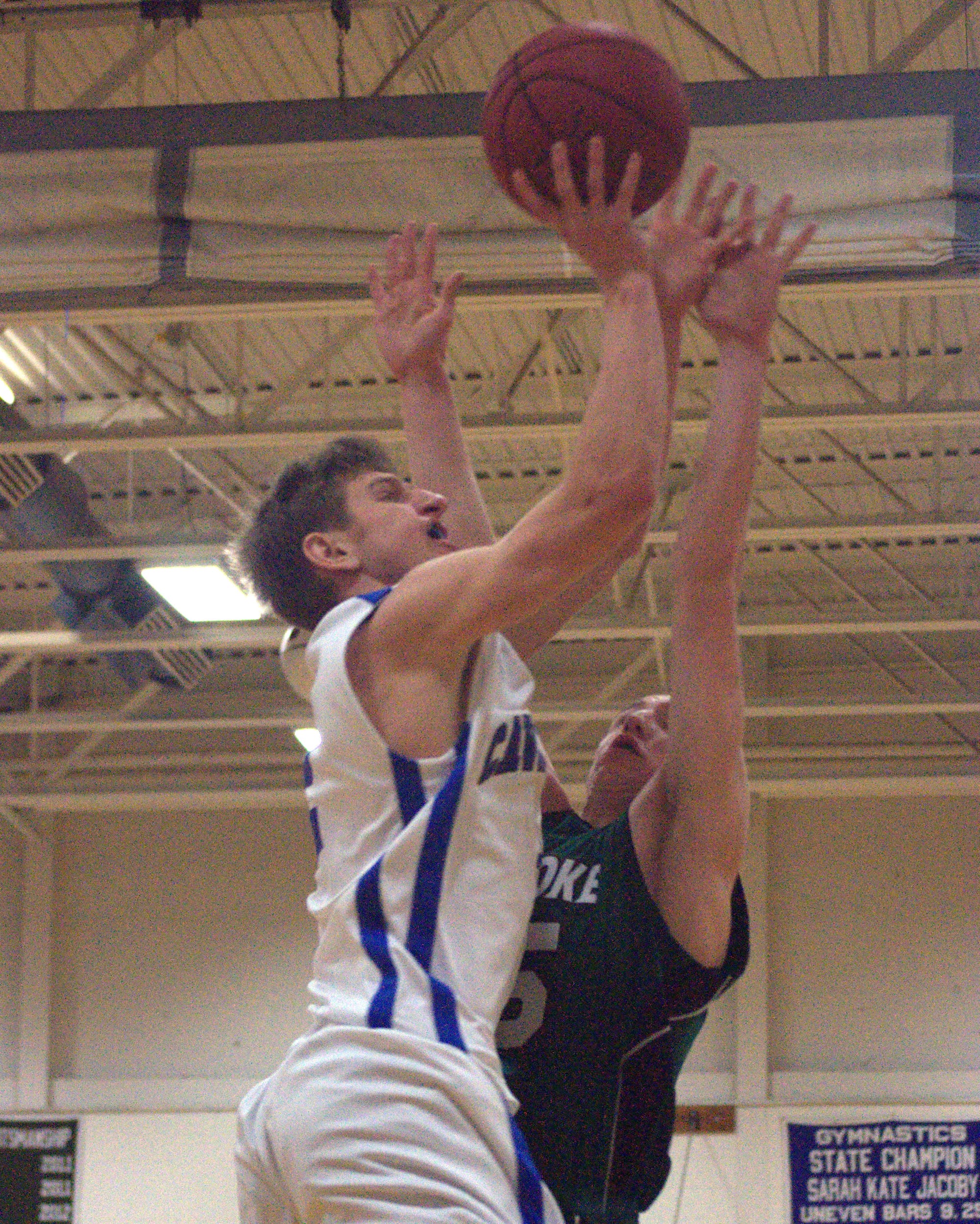 Hollis Brookline's Connor Walsh drives to the basket.